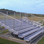 View 8 Row Deluxe Bleachers With Chainlink Guardrails ( NA-0815DLX_CLC )